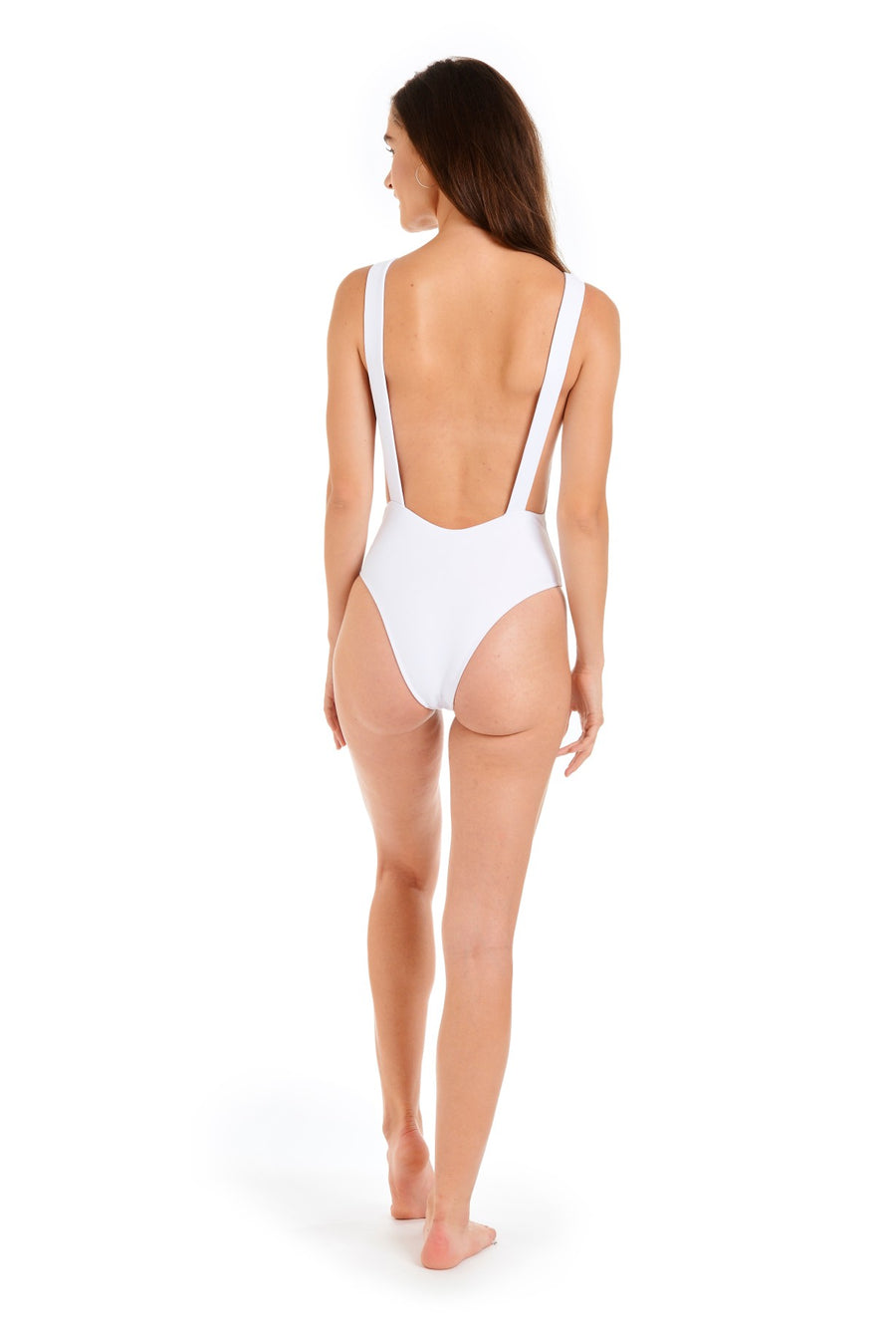 Back view of a woman wearing a white one piece swimsuit