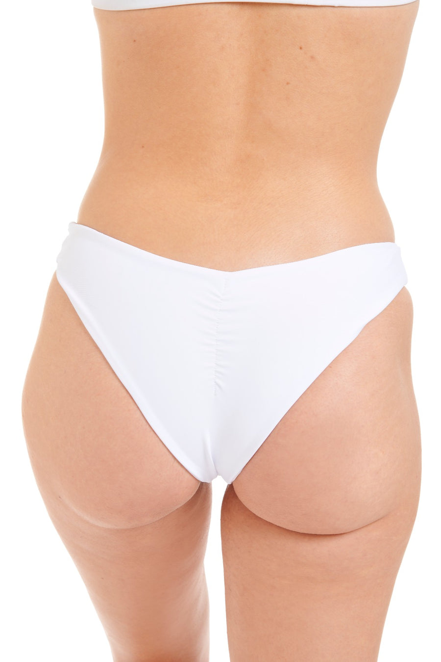 Close up back view of a woman in white swim bottoms