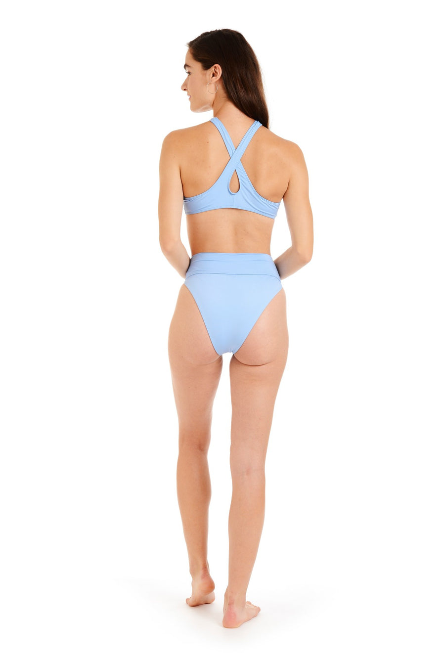 Back view of a woman in light blue swimsuit bottoms