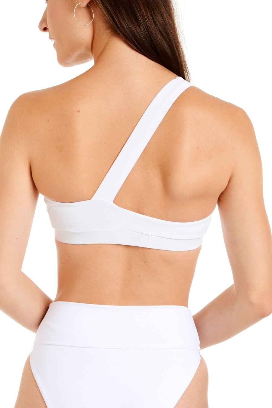 Back close up view of a white one shoulder bikini top